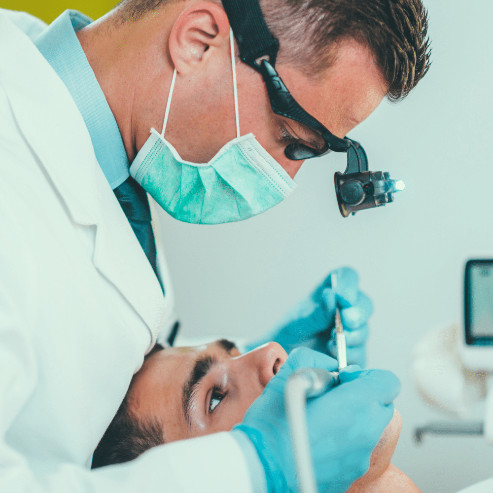 Doctor examining patients mouth